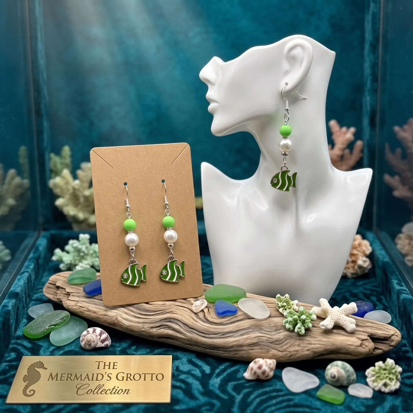 Green tropical fish earrings in a sea-inspired display